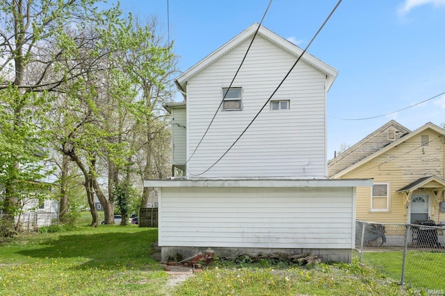 exterior space with a lawn and fence