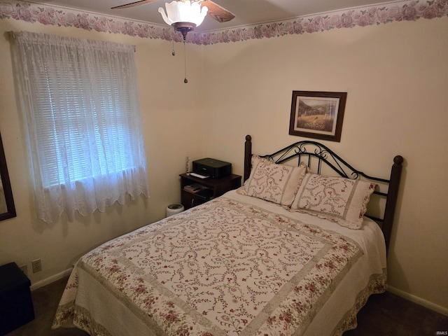 bedroom with baseboards, a ceiling fan, and carpet floors