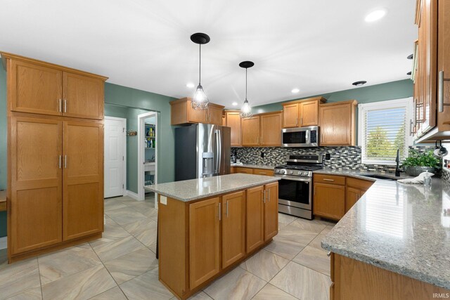 1206 Phaeton Way, Auburn, IN 46706 - kitchen with a kitchen island, light stone countertops, tasteful backsplash, a sink, and appliances with stainless steel finishes