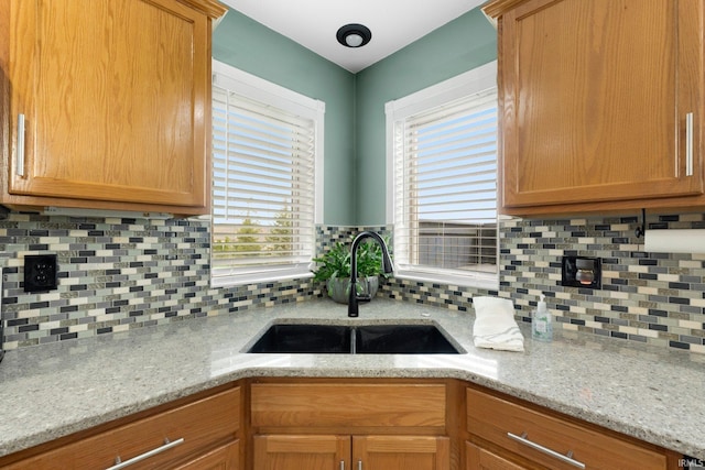1206 Phaeton Way, Auburn, IN 46706 - kitchen featuring plenty of natural light, a sink, and tasteful backsplash