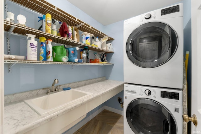 1206 Phaeton Way, Auburn, IN 46706 - washroom featuring laundry area, stacked washing maching and dryer, and a sink