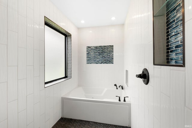 1206 Phaeton Way, Auburn, IN 46706 - bathroom featuring walk in shower, tile walls, and a tub to relax in