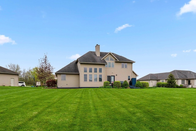 1206 Phaeton Way, Auburn, IN 46706 - back of property with a lawn and a chimney