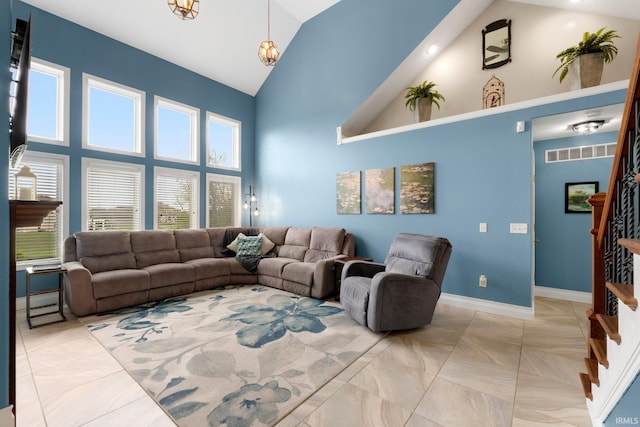 1206 Phaeton Way, Auburn, IN 46706 - living area featuring stairs, high vaulted ceiling, visible vents, and baseboards