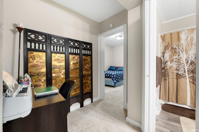 home office featuring carpet floors and baseboards