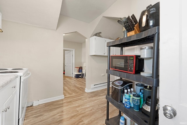 kitchen featuring white electric stove, baseboards, white cabinets, a baseboard radiator, and light wood-style flooring