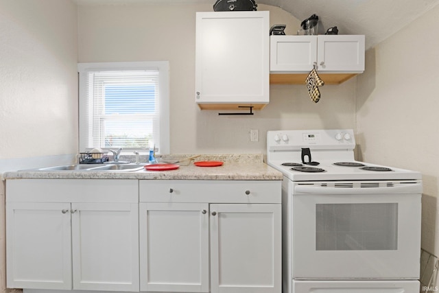 kitchen featuring white electric range, a sink, white cabinets, and light countertops