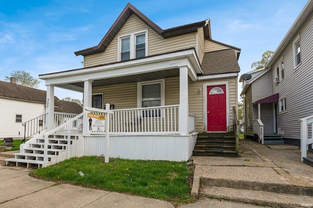 bungalow with covered porch and entry steps