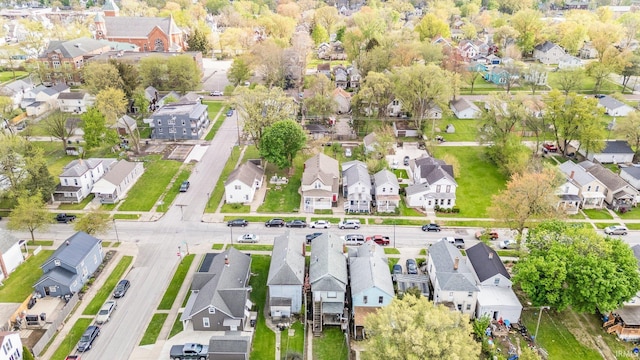 birds eye view of property with a residential view