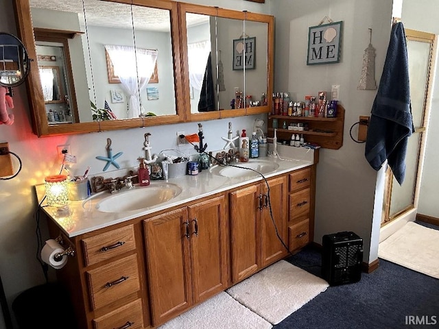 full bathroom with double vanity and a sink