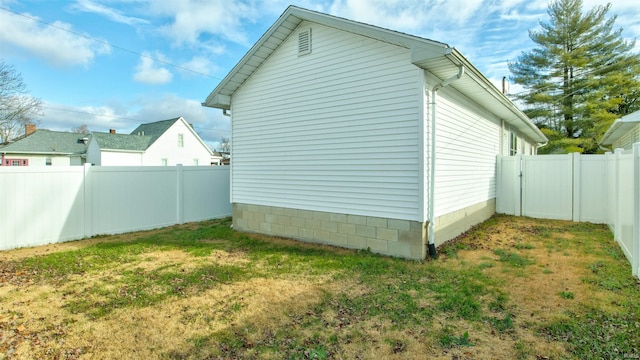 view of property exterior featuring a fenced backyard and a yard