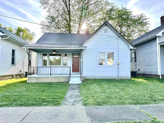 1045 13th St, Tell City, IN 47568 - view of front of property featuring a porch, a front lawn, ceiling fan, and metal roof