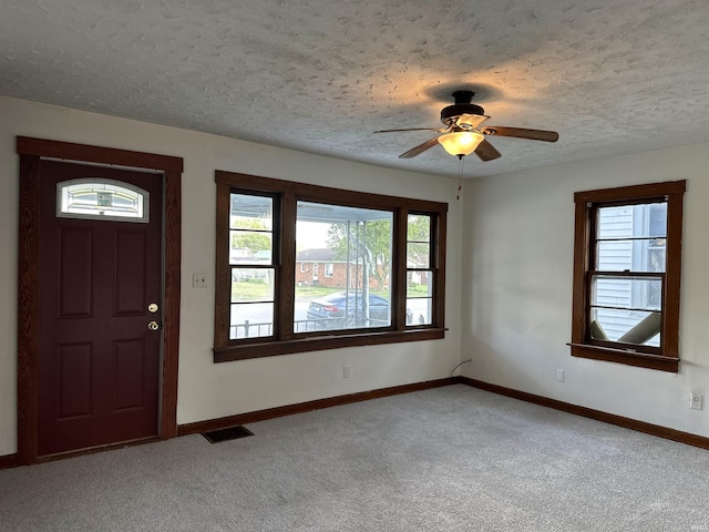 1045 13th St, Tell City, IN 47568 - carpeted entrance foyer featuring baseboards, plenty of natural light, and ceiling fan