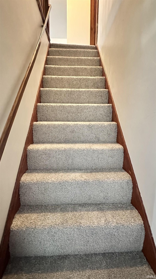 1045 13th St, Tell City, IN 47568 - stairway featuring carpet