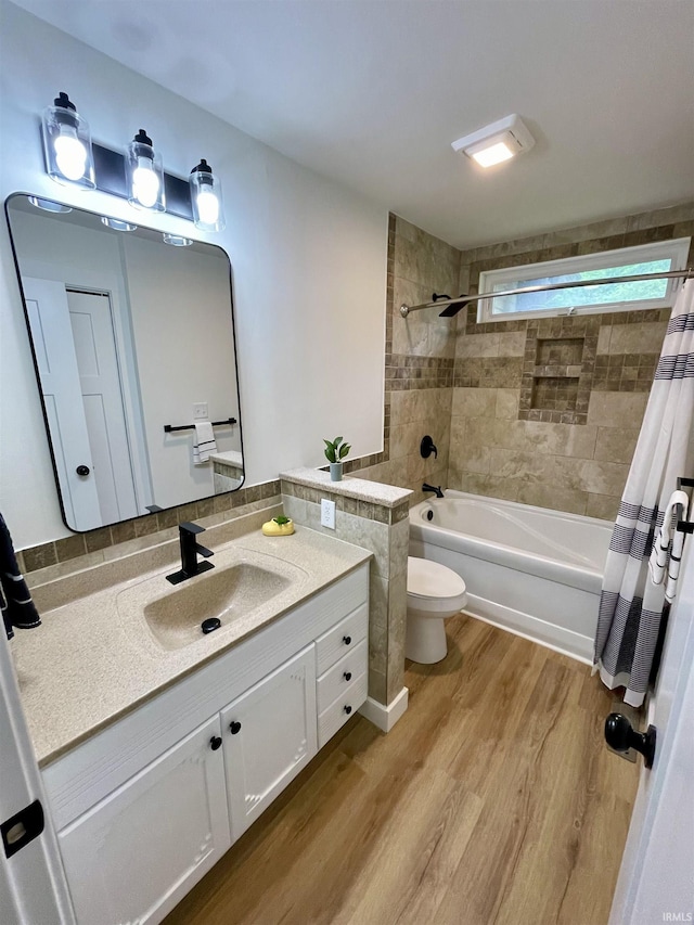 4970 S 700 W, Owensville, IN 47665 - bathroom featuring shower / tub combo with curtain, toilet, wood finished floors, and vanity