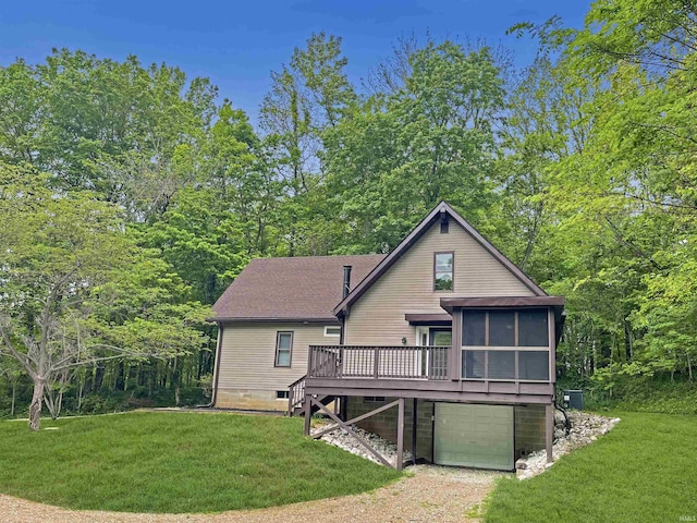 4970 S 700 W, Owensville, IN 47665 - back of house with an attached garage, a deck, a lawn, driveway, and a sunroom
