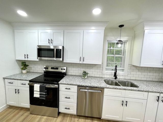 4970 S 700 W, Owensville, IN 47665 - kitchen featuring appliances with stainless steel finishes, a sink, light wood-style flooring, white cabinets, and recessed lighting