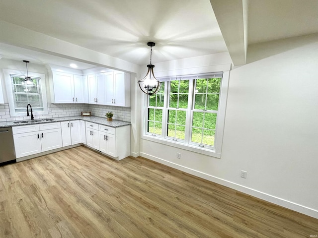 4970 S 700 W, Owensville, IN 47665 - kitchen with baseboards, a sink, dishwasher, a chandelier, and light wood-style flooring
