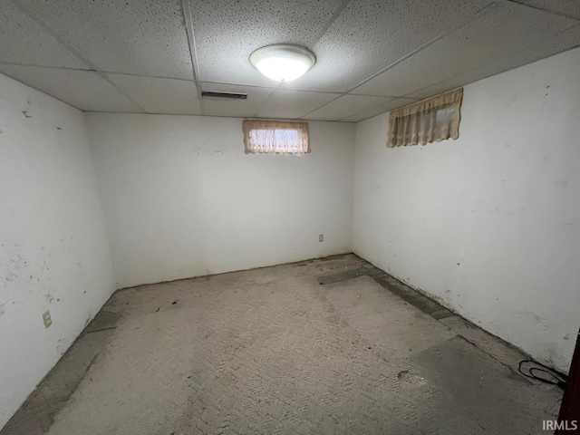 below grade area with visible vents and a drop ceiling