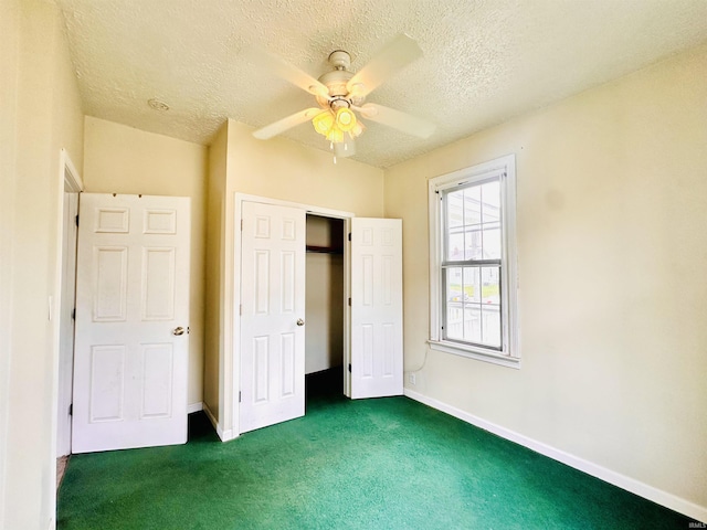 1037 14th St, Tell City, IN 47568 - unfurnished bedroom featuring baseboards, carpet flooring, a textured ceiling, and a ceiling fan