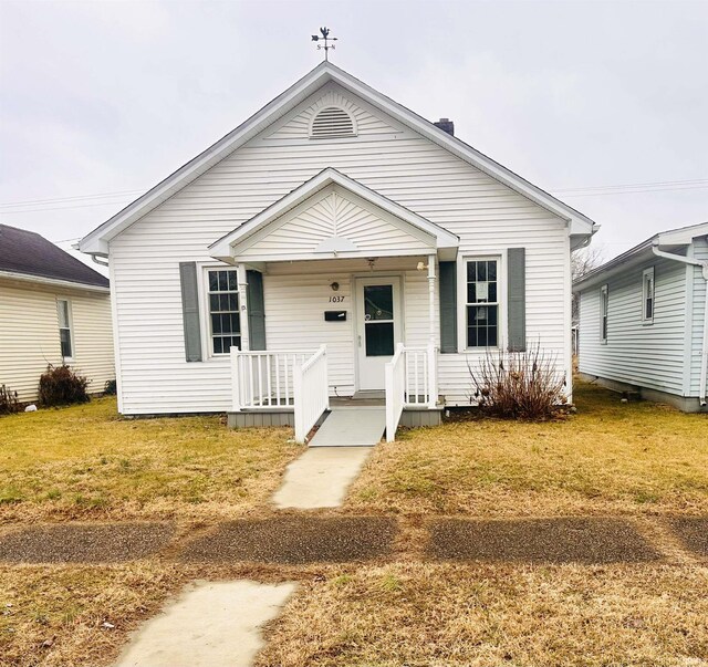 1037 14th St, Tell City, IN 47568 - bungalow-style home with a porch and a front yard