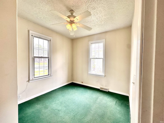 1037 14th St, Tell City, IN 47568 - unfurnished room with visible vents, a healthy amount of sunlight, and dark carpet
