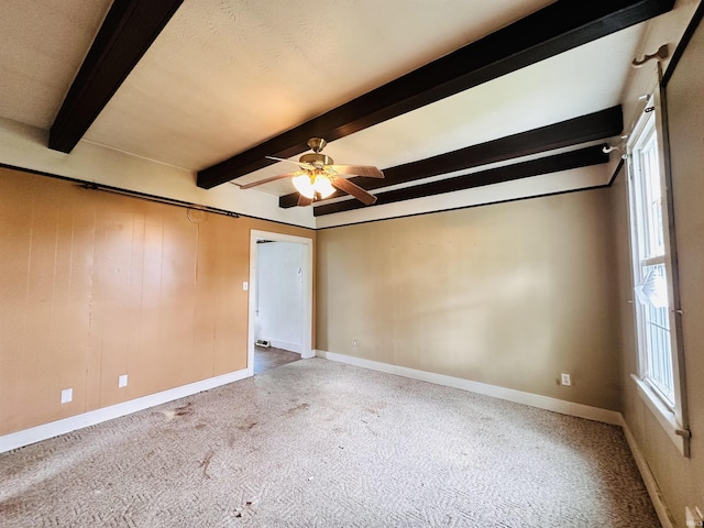 1037 14th St, Tell City, IN 47568 - carpeted empty room featuring baseboards, ceiling fan, and beamed ceiling
