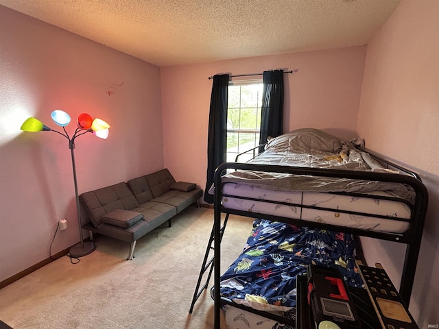 carpeted bedroom with a textured ceiling
