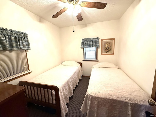carpeted bedroom with a ceiling fan