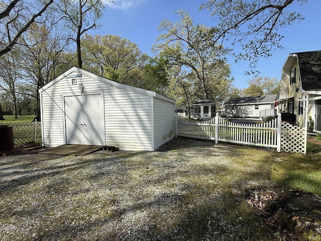 view of shed with fence