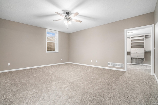 unfurnished bedroom with visible vents, carpet flooring, and baseboards