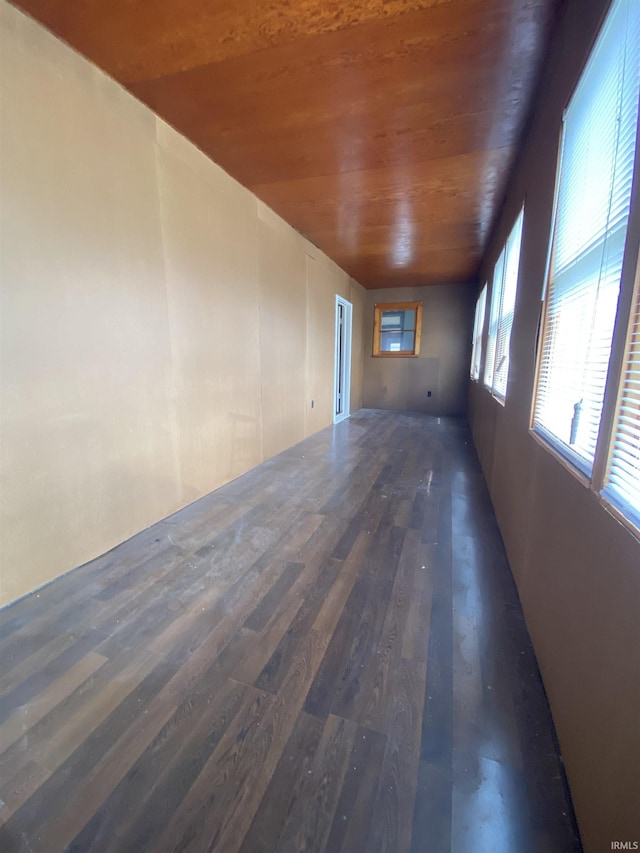unfurnished room featuring wood ceiling and wood finished floors