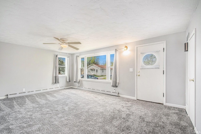 entrance foyer featuring baseboards, a textured ceiling, carpet, and a baseboard heating unit