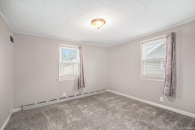 spare room with visible vents, crown molding, baseboard heating, baseboards, and carpet