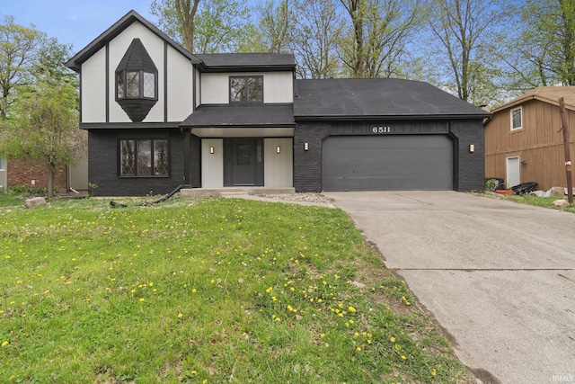 tudor house featuring brick siding, a garage, and concrete driveway