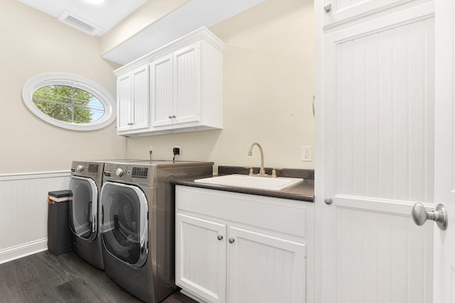 275 Ln 101 Hamilton Lk, Hamilton, IN 46742 - clothes washing area featuring cabinet space, a sink, dark wood finished floors, visible vents, and washer and clothes dryer