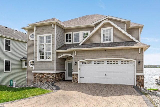 275 Ln 101 Hamilton Lk, Hamilton, IN 46742 - craftsman inspired home with roof with shingles, stone siding, and decorative driveway