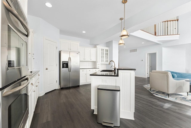 275 Ln 101 Hamilton Lk, Hamilton, IN 46742 - kitchen with a sink, stainless steel appliances, dark wood finished floors, and open floor plan