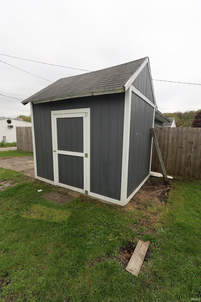 view of shed with fence