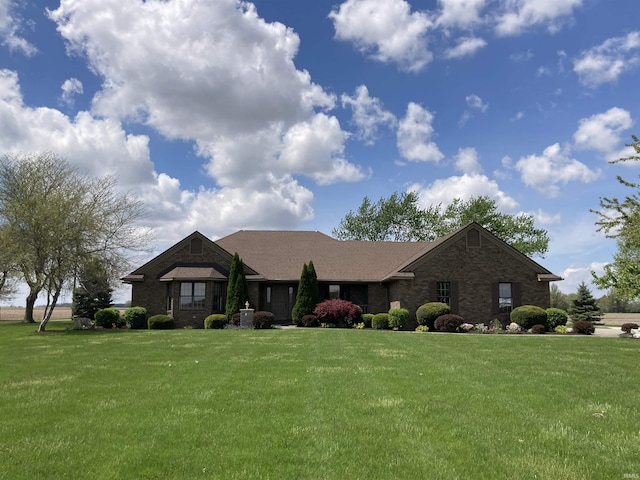 760 N 700 E, Bluffton, IN 46714 - view of front facade featuring brick siding and a front yard