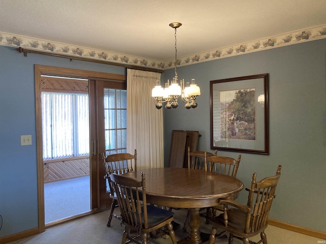 760 N 700 E, Bluffton, IN 46714 - carpeted dining space featuring baseboards and a notable chandelier