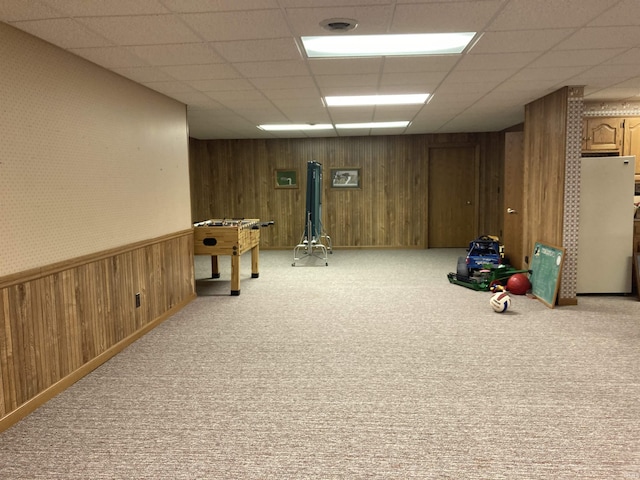 760 N 700 E, Bluffton, IN 46714 - recreation room featuring wood walls, a drop ceiling, and light carpet