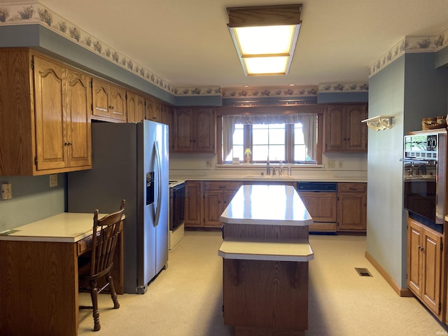 760 N 700 E, Bluffton, IN 46714 - kitchen featuring visible vents, oven, stainless steel refrigerator with ice dispenser, a center island, and paneled dishwasher
