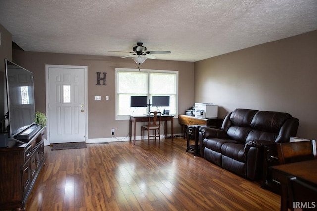 3701 Wethersfield Dr, Evansville, IN 47725 - living area with ceiling fan, dark wood finished floors, a textured ceiling, an office area, and baseboards