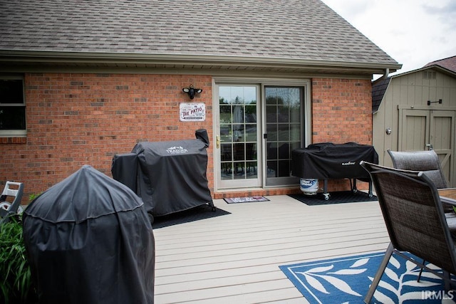 3701 Wethersfield Dr, Evansville, IN 47725 - deck featuring a shed, a grill, and an outdoor structure