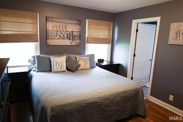 3701 Wethersfield Dr, Evansville, IN 47725 - bedroom featuring wood finished floors, baseboards, and a textured ceiling
