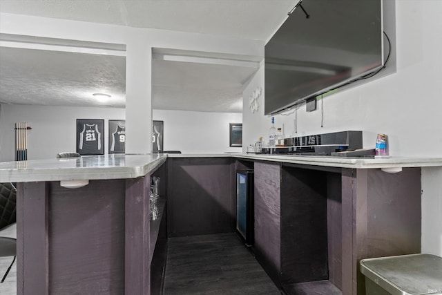 29930 Prairieview Farms Blvd, Elkhart, IN 46514 - kitchen featuring light countertops, a kitchen breakfast bar, and dark wood-style flooring
