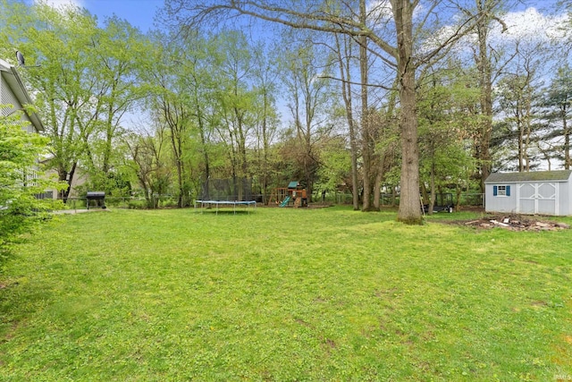 29930 Prairieview Farms Blvd, Elkhart, IN 46514 - view of yard with a trampoline, a storage shed, a fenced backyard, an outbuilding, and a playground