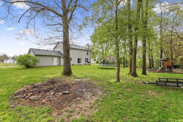29930 Prairieview Farms Blvd, Elkhart, IN 46514 - view of yard featuring a playground and a trampoline