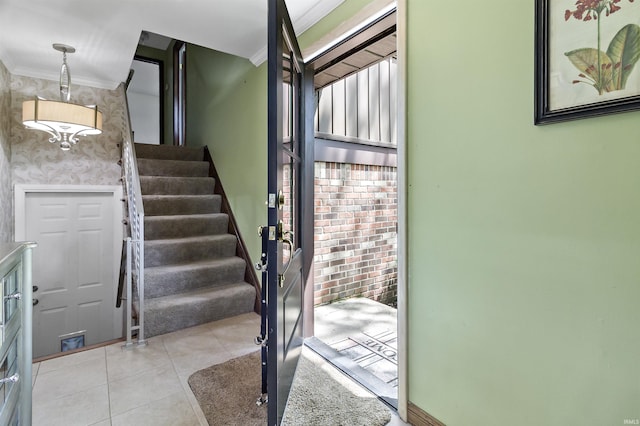 4231 N Conner Dr, Marion, IN 46952 - entryway featuring crown molding, stairs, light tile patterned floors, and wallpapered walls